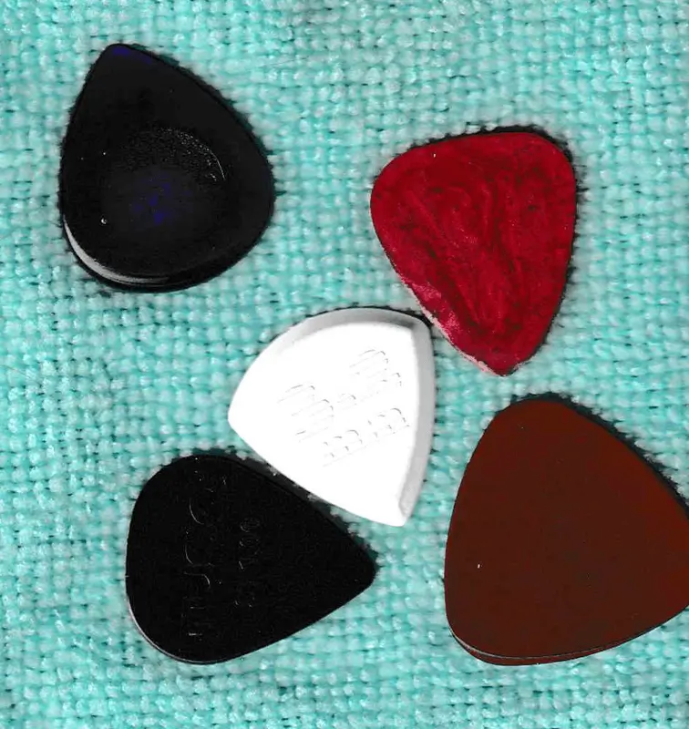 5 of my few Opaque Plastic Picks of very different materials and colors, TL: Ultex, TR: Resin, C: Thermoplastic, BL: Tusq, BR: Vespel.