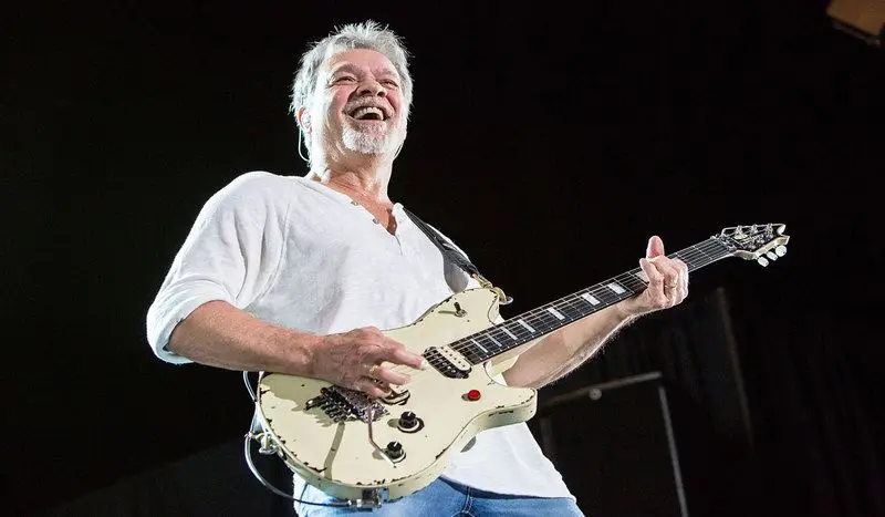 The incredible EVH, Eddie Van Halen wailing on one of his fine and well worn guitars.
