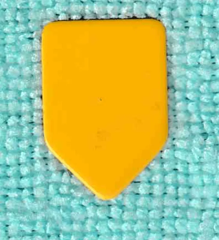 An example of a Cream Yellow Celluloid "Homeplate" shaped pick, a Vintage that was given to me as a bonus pick.
