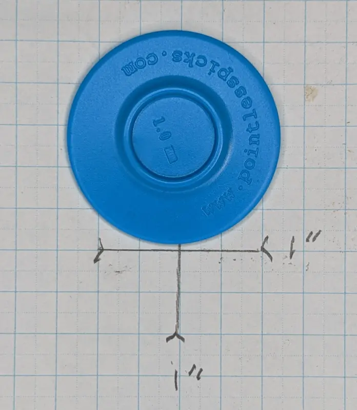 For size reference, the blue Pointless Pick against 1/4" ruled graph paper
