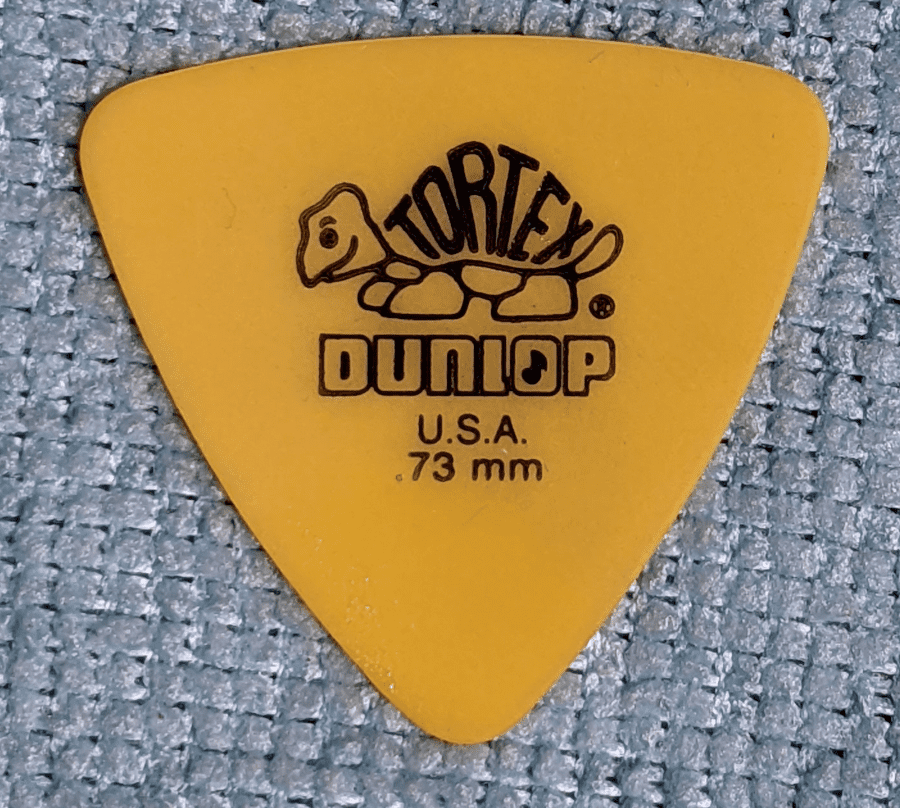 Dunlop's Yellow Tortex Realeaux .73 on a blue background.