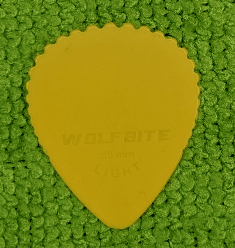 Introducing the Wolf Bite Serrated Light Yellow Guitar Pick