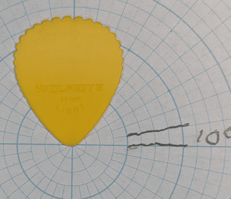 The Wolf Bite Serrated Top Pick in light gauge over angle paper