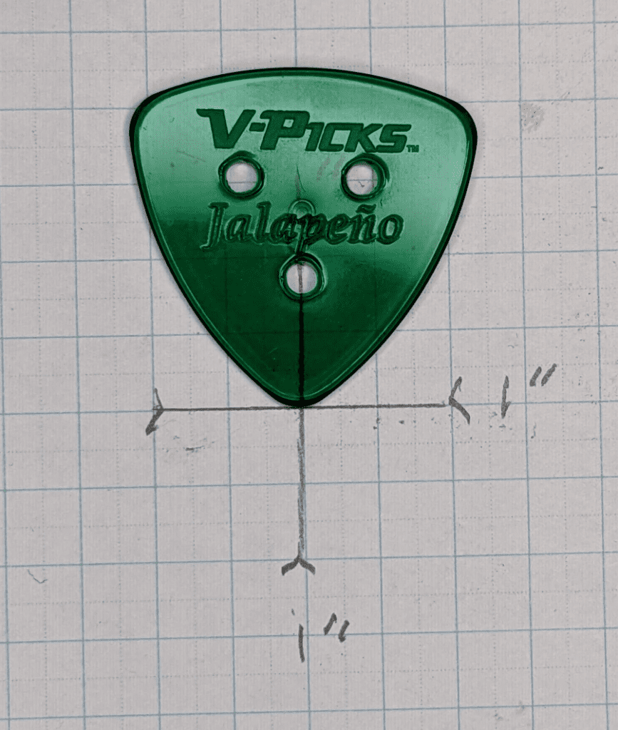The V-Picks Jalapeno Pick over Graph Paper for size reference