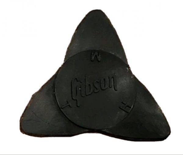Photo of a Vintage Gibson Propeller Pick in Black of the Vintage HomePlate Pick Yellow of the Polygons, Circles, Rhomboids, HomePlates, and Home Plates