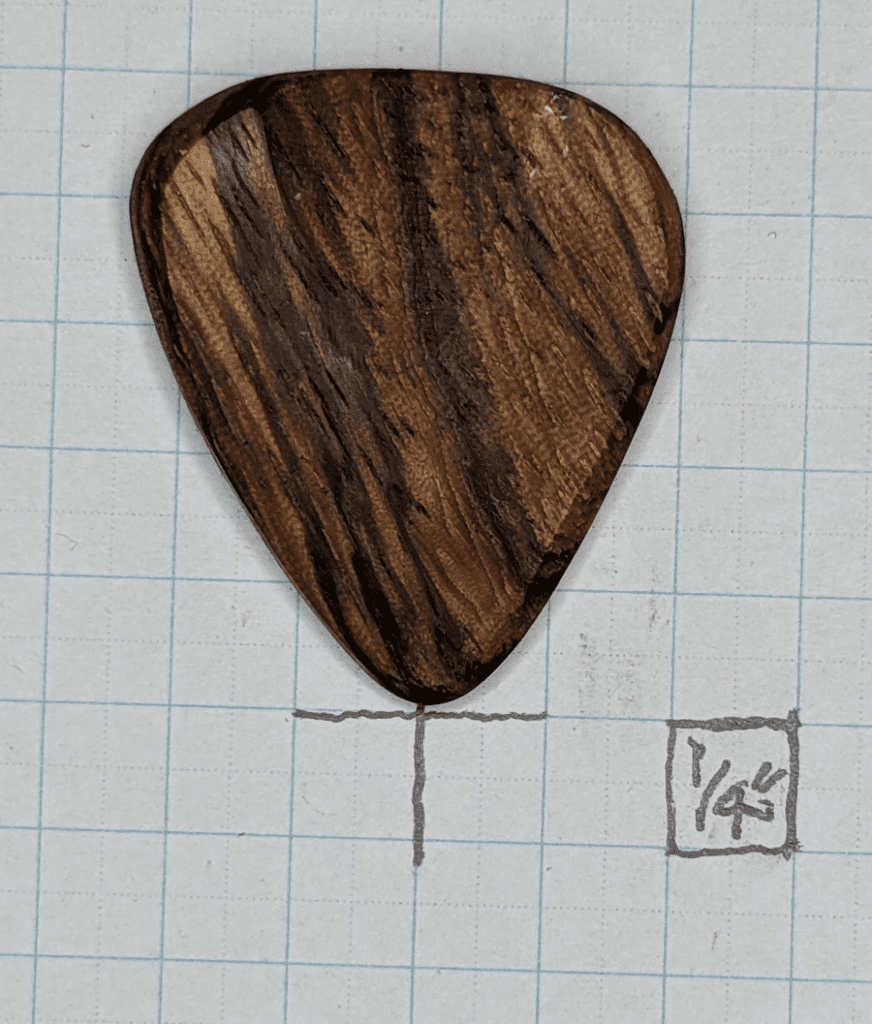 The Zebra Wood Plectrum against 1/4" Graph Paper for Reference