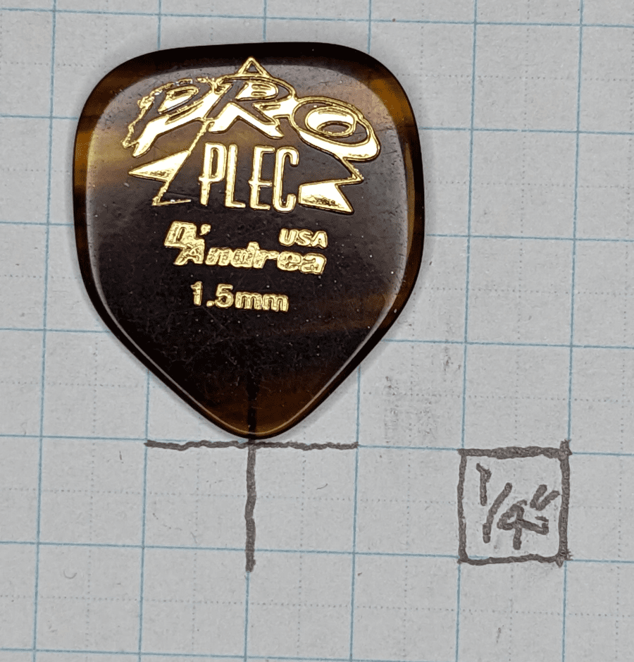 The D'Andrea Pro Plec Series Home Plate 1.5 mm thermoplastic pick on Graph Paper background
