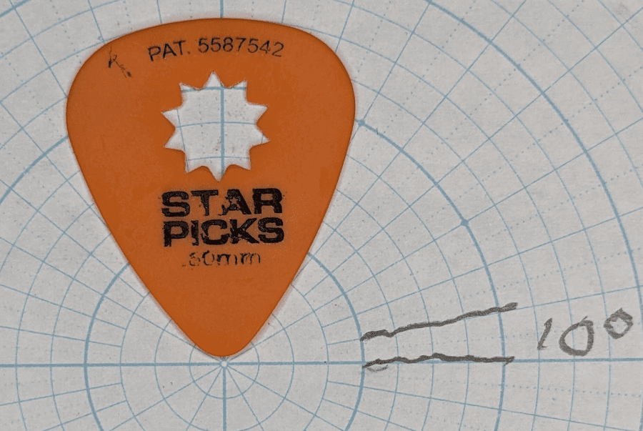 The Everly Orange Star Pick on Angle Paper Background for Angle Reference