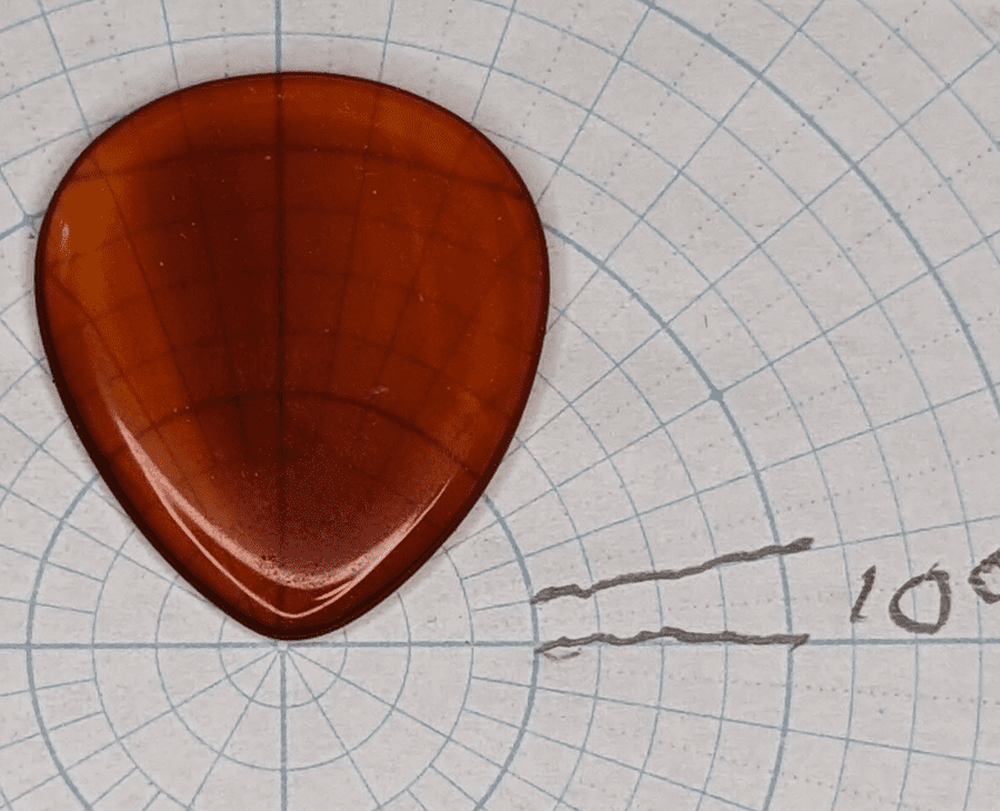 The Dustin Headrick Agate PIck upon Angle paper for shape reference
