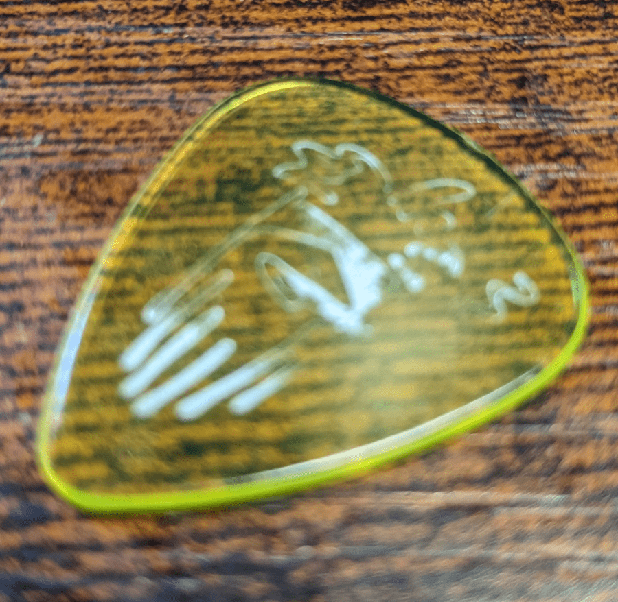 An image of the Billy Gibbons Reverend Willy's Dunlop Yellow pick with Ink starting to rub off (not too easy to see in this image, sorry)