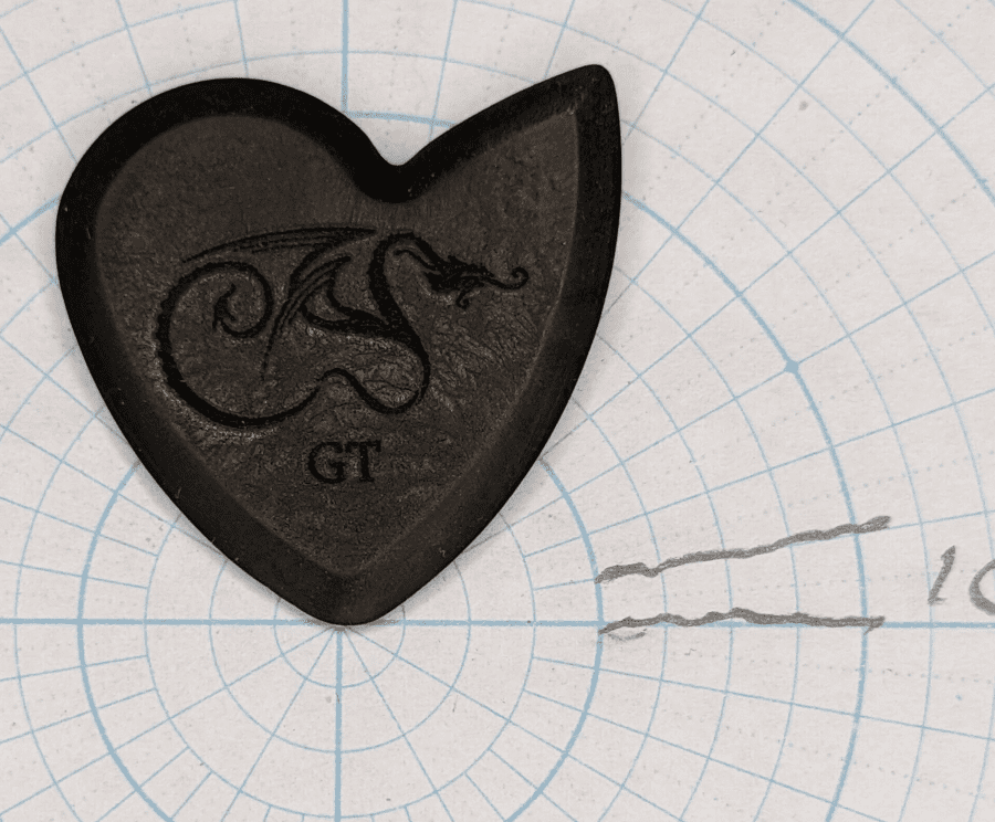 The Dragon's Heart Pick Viewed Wide Tip into Angle Paper for Shape Reference.