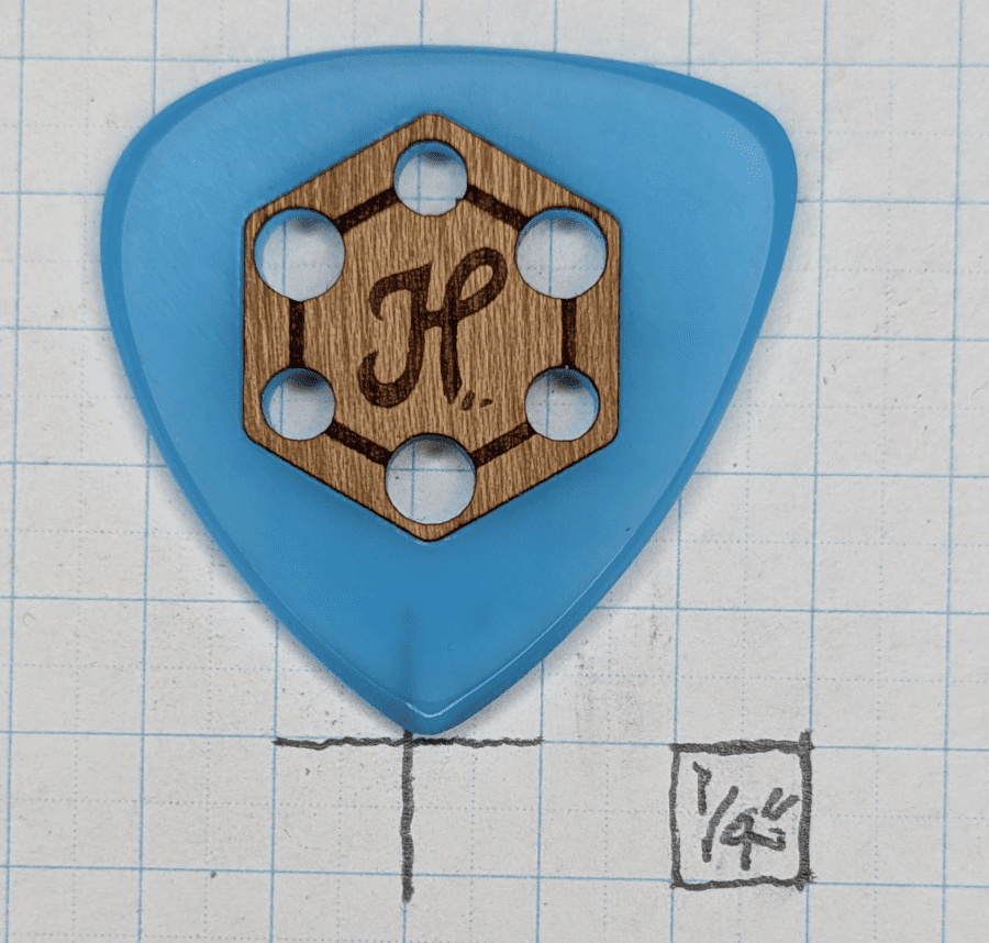 Honey Picks Tri-Tip Blue Glow with Wood Grip Guitar Pick. A Glow-Cast Blue Acrylic Guitar Pick With a Pretty Wooden Grip.