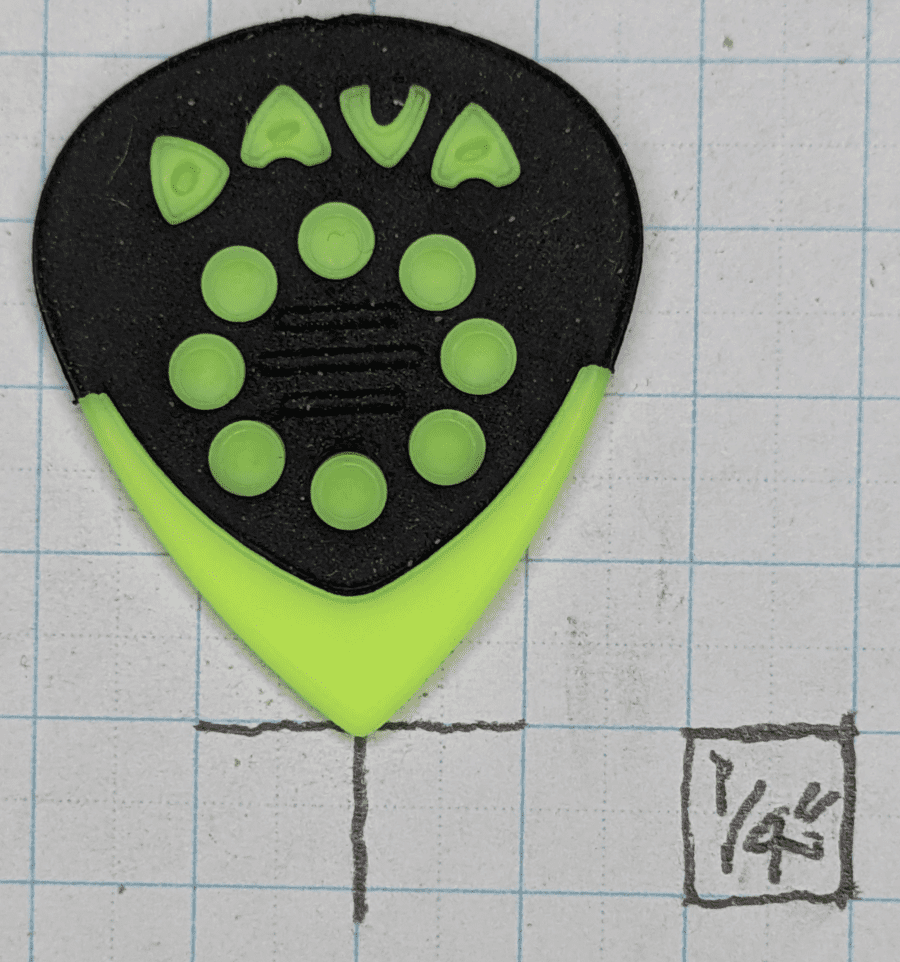 The Dava Jazz Nylon Yellow-Green Pick on Graph Paper. With 1/4" ruled background paper, the smallish Jazz III Shape is apparent...