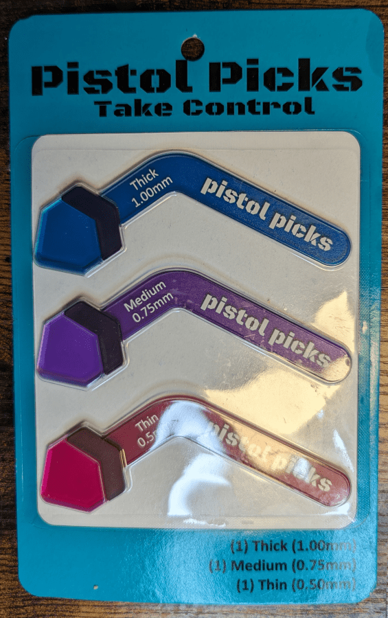 Pistol Picks Brand Three Size Variety. A "Heavey" and "Medium" and a "light" clear poly pick pack.